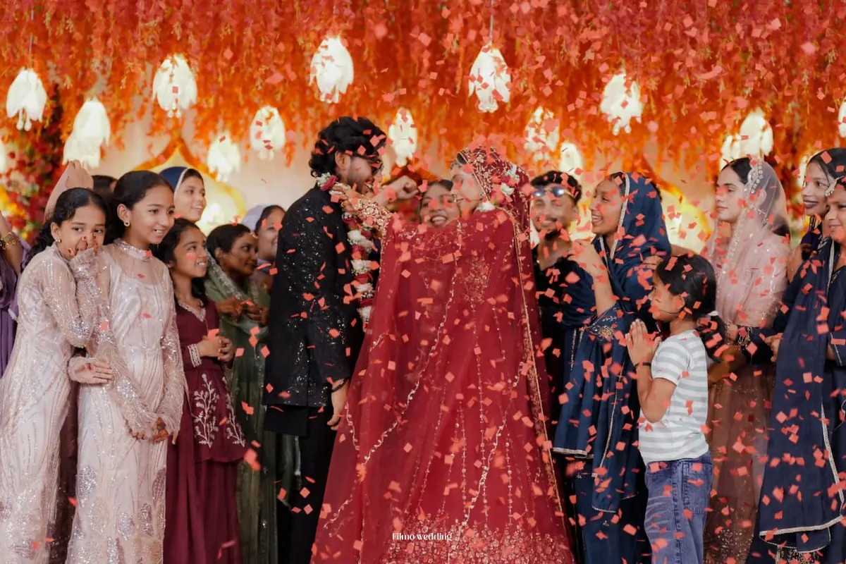 Bride and groom under a shower of confetti — Shadhi Catering and Event Management